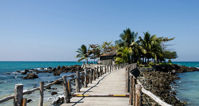 The bamboo bridge leads to the beach