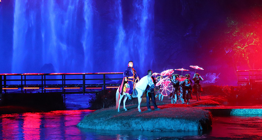 The attractive performance on the foot of the waterfall