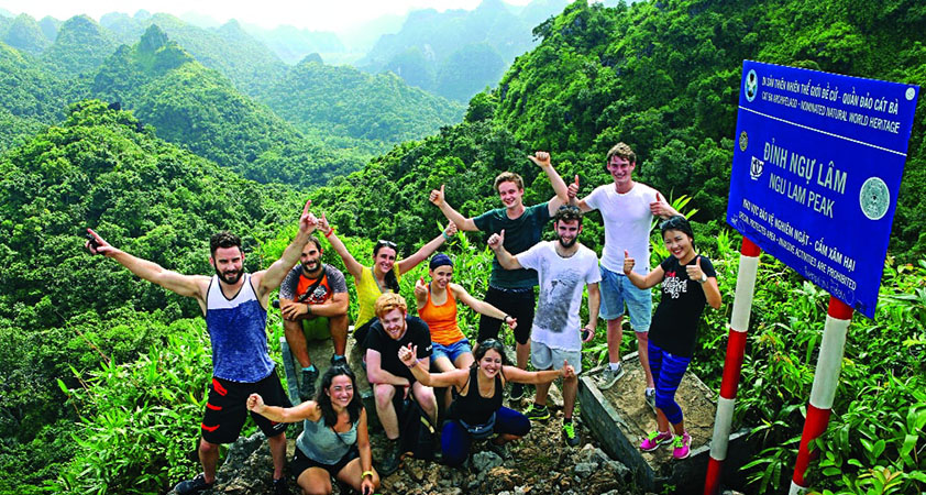 Tourists getting excited during the trekking tour in Cat Ba Island National Park