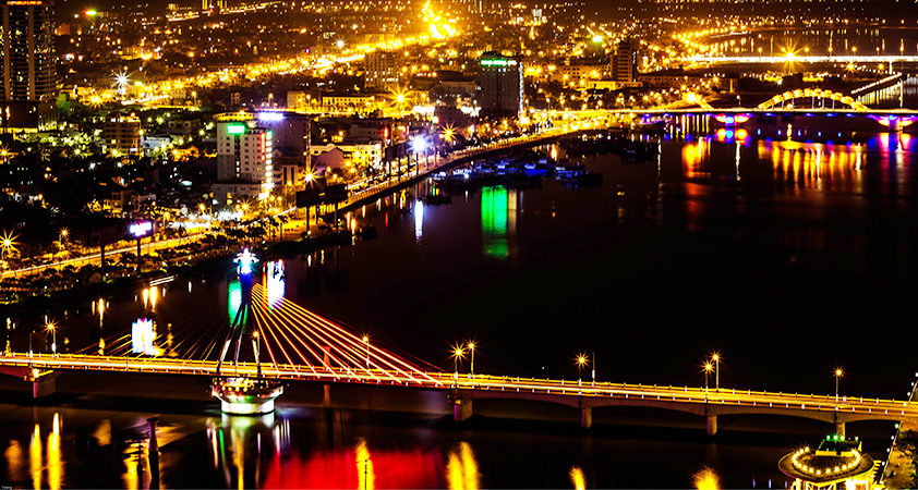 Tourists get excited when the bridge starts to swing at night