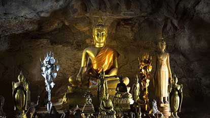 Pak Ou caves - Caves in the cliffs on the Mekong filled with 1000???s of Buddha images