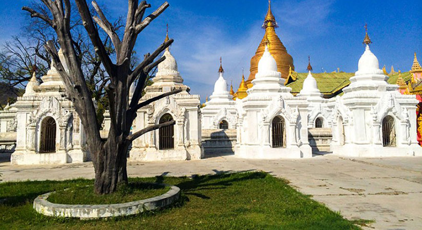 Keep exploring Mandalay with an exploration of the Kuthodaw Pagoda with its 729 marble stone slabs of Buddhist scriptures