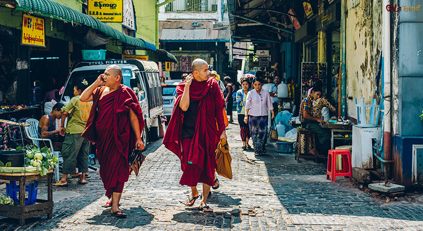 Wander around a traditional market in Yangon before departuring