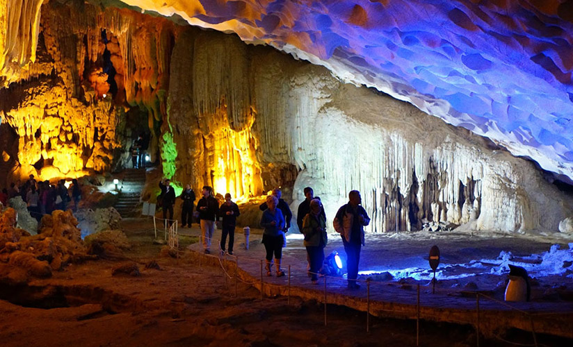 On the way to explore Halong Bay, you can make a stop at some beautiful caves of Halong