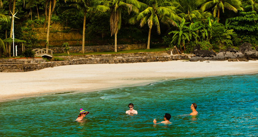 Swimming in clear water on Rang Dua island